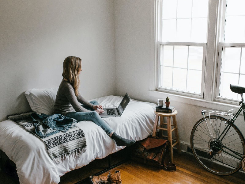 student attending online class in their room